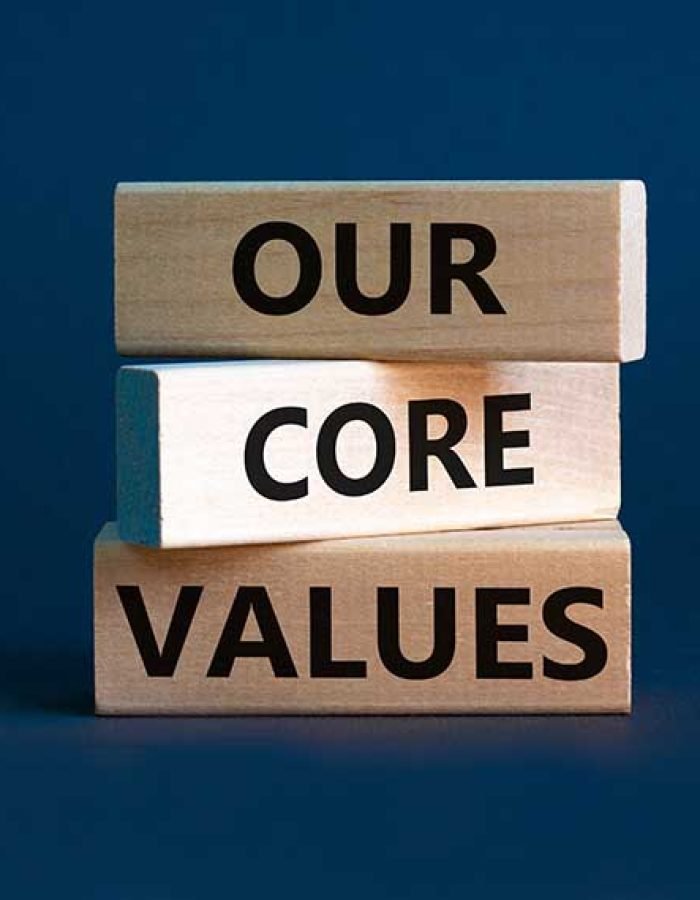 Our core values symbol. Concept words 'Our core values' on wooden blocks on a beautiful grey background. Business and our core values concept. Copy space.
